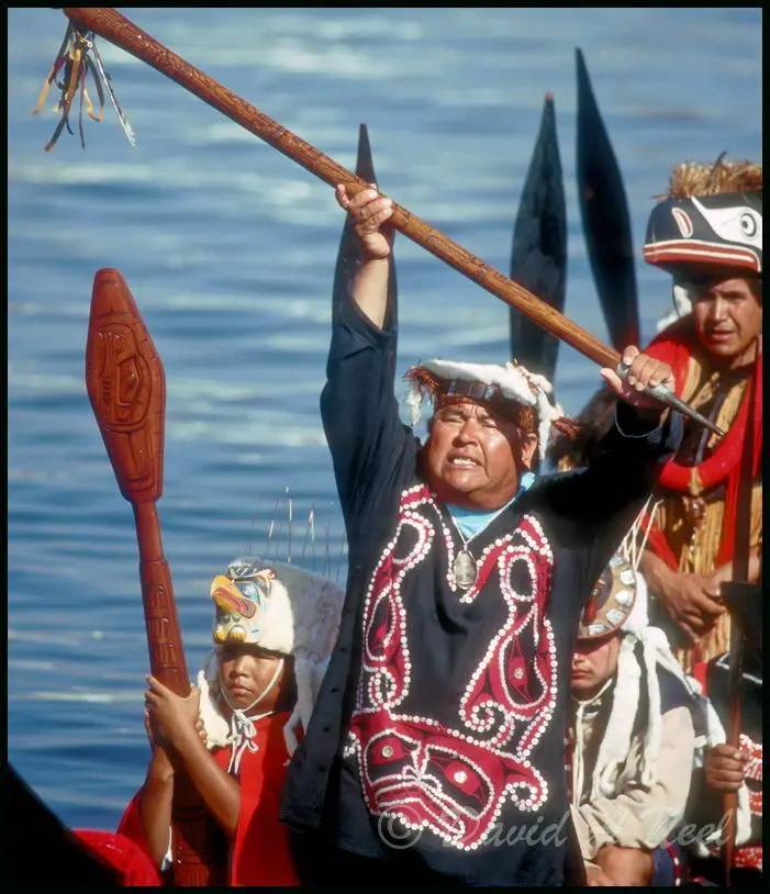 Kwakwak'awakw chief with a talking stick.