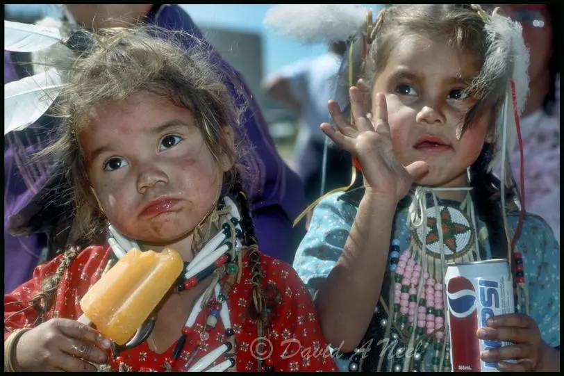 Native girls enjoying a snack at a powwow.
