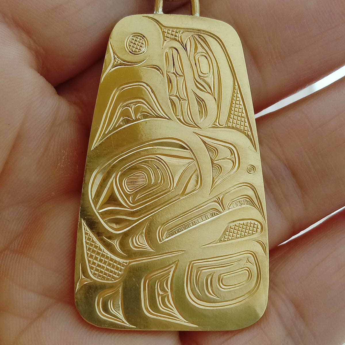 Thunderbird gold pendant